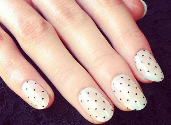 white nails with small black dots 