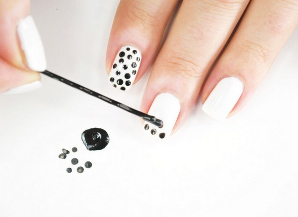 white nails with black dots