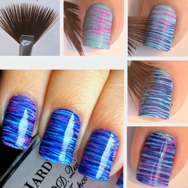 image of thin makeup brush creating stripes with nail polish on someone's nails