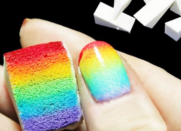 rainbow colors on a sponge placed onto a nail