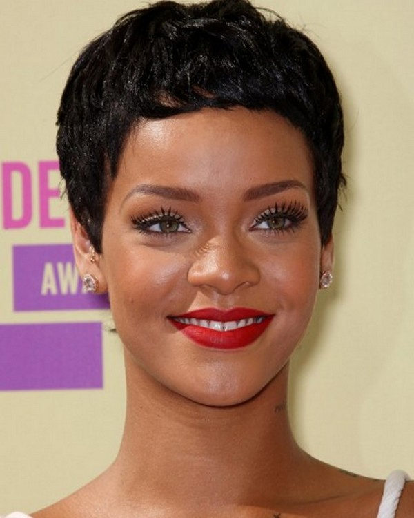 Rihanna adorning a short black pixie haircut with high bangs 