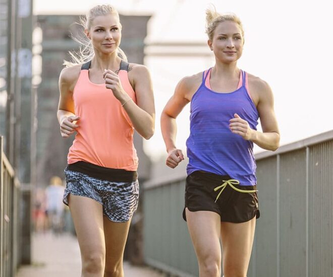 two women jogging outside