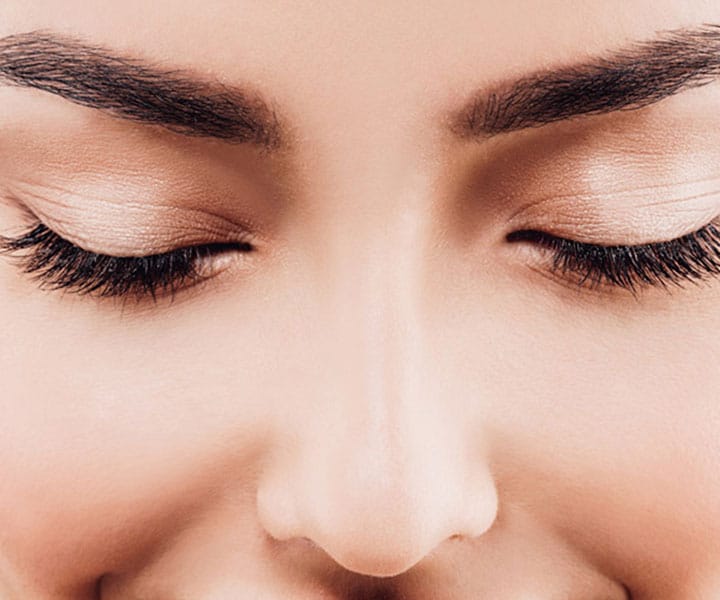 an image of a woman with her eyes closed with long eyelashes