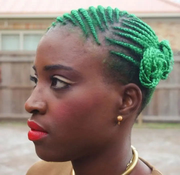 green double buns with ghana braids