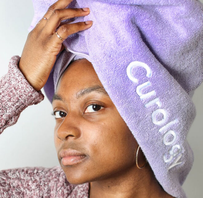 black woman with a towel on her head 