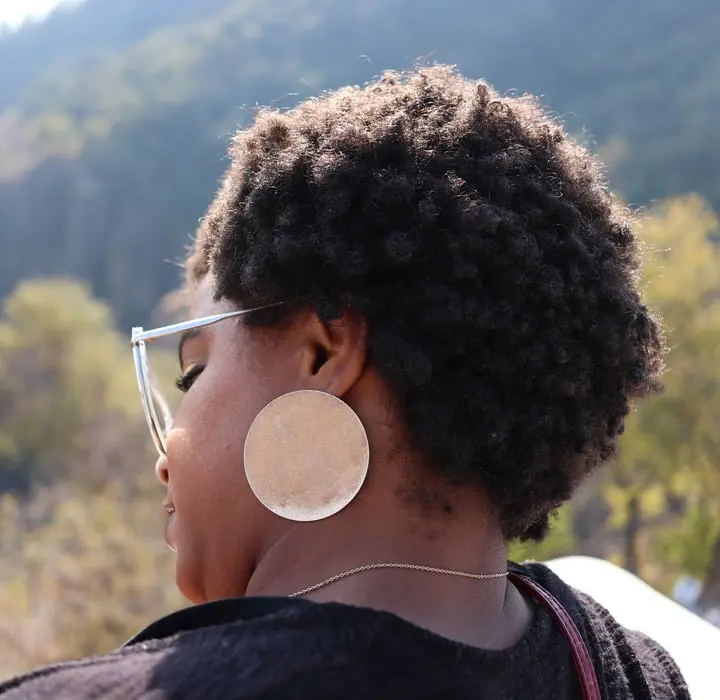 Black Woman with Short Afro Hair and Bog Gold Earrings 