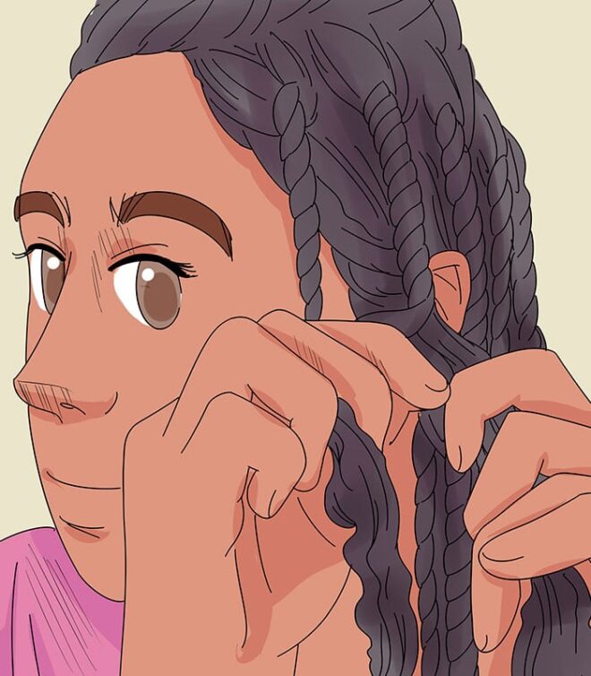 woman braiding her hair