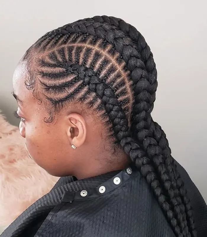 woman with long fishbone braids
