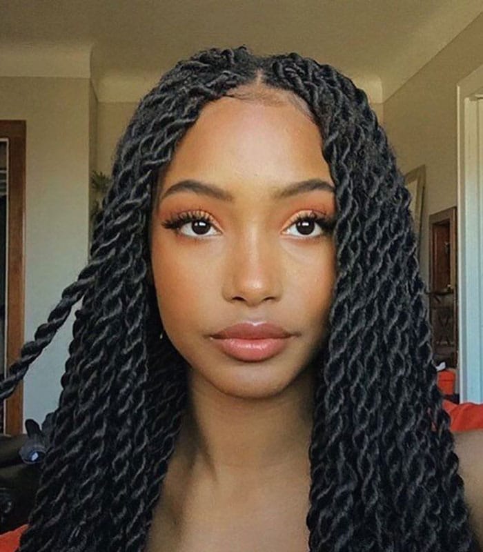 woman with long twist braids