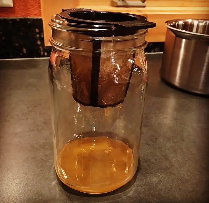 homemade amla oil using glass jar and strainer