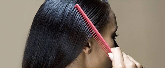 woman brushing her hair for marley braids
