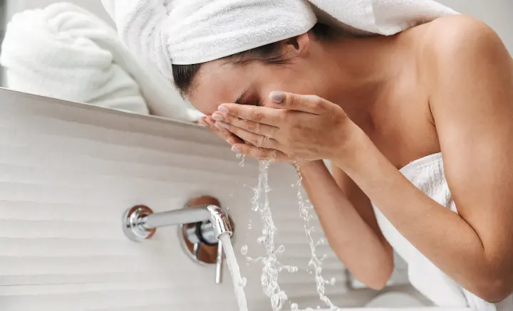 woman washing face