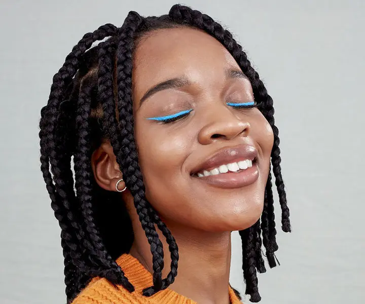 woman with bob hairstyle with jumbo box braids