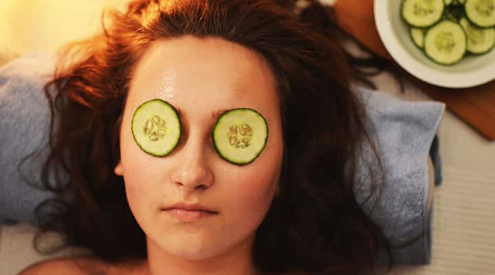 woman with homemade face mask and cucumber jpg