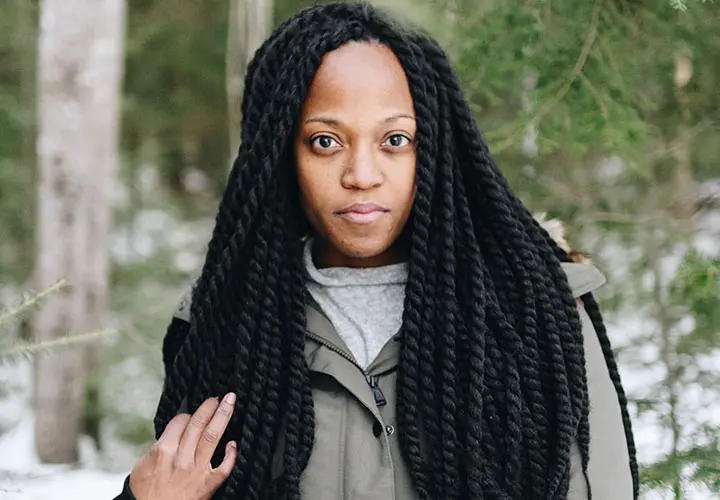 woman with long jumbo box braids