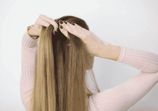 woman starting to plait hair